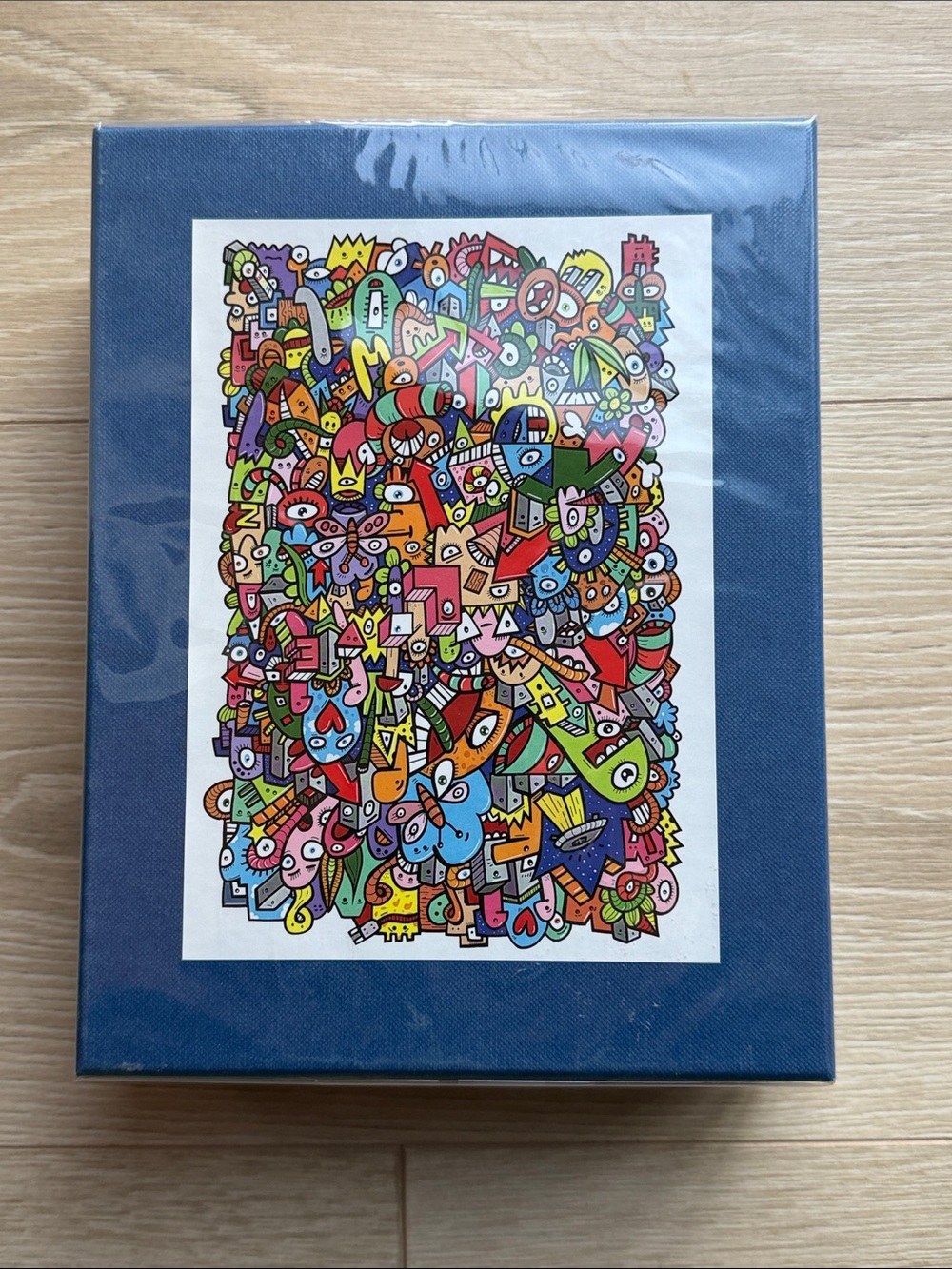 Puzzle by Michele Wilson Multicolor Abstract Doodle Art Print with Blue Border